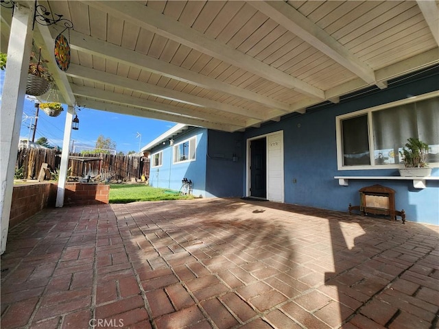 view of patio featuring fence