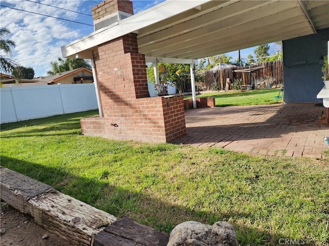 view of yard with a patio area and fence