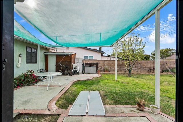 view of yard featuring a patio area and a fenced backyard