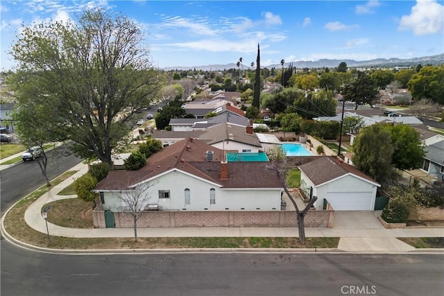 birds eye view of property featuring a mountain view