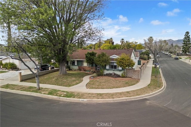 view of front of home featuring a mountain view