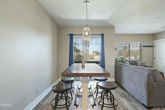 dining room with wood finished floors and baseboards