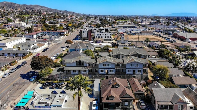 drone / aerial view featuring a mountain view and a residential view