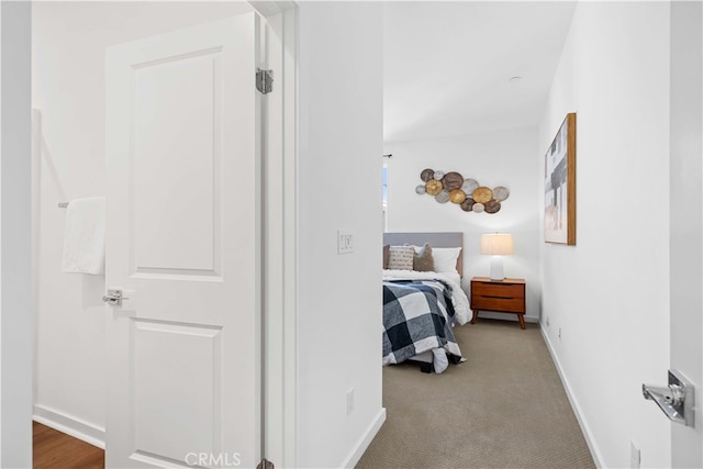 carpeted bedroom with baseboards