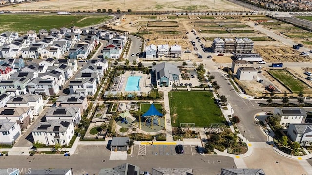 birds eye view of property with a residential view