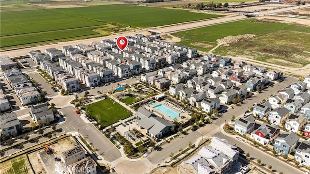 birds eye view of property with a residential view