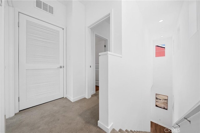 hall with baseboards, carpet, visible vents, and recessed lighting