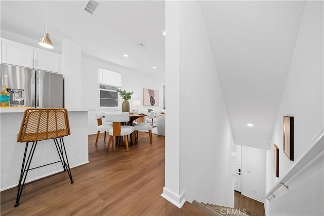 interior space featuring recessed lighting, visible vents, and wood finished floors