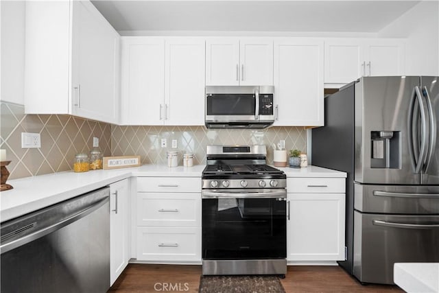 kitchen with white cabinetry, stainless steel appliances, and light countertops