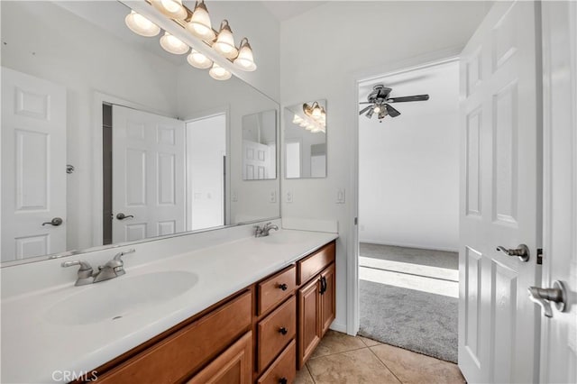 full bath with double vanity, tile patterned flooring, ceiling fan, and a sink