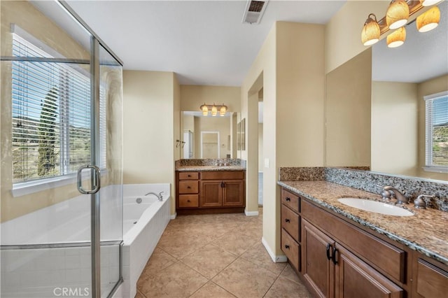 full bath featuring a wealth of natural light, a sink, and a shower stall