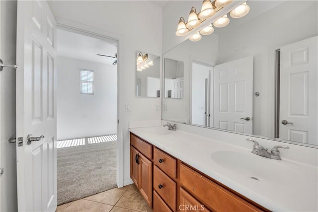 bathroom featuring double vanity, tile patterned flooring, and a sink