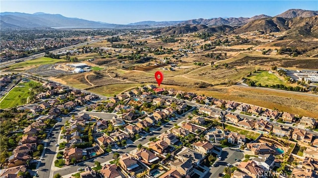 birds eye view of property with a residential view and a mountain view