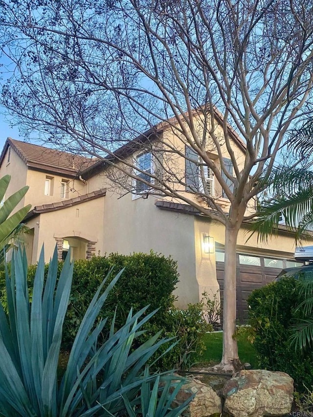 view of property exterior with stucco siding