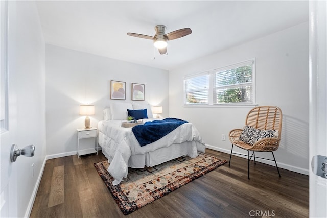 bedroom featuring wood finished floors, a ceiling fan, and baseboards