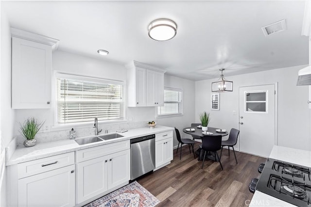 kitchen with a sink, visible vents, light countertops, and dishwasher