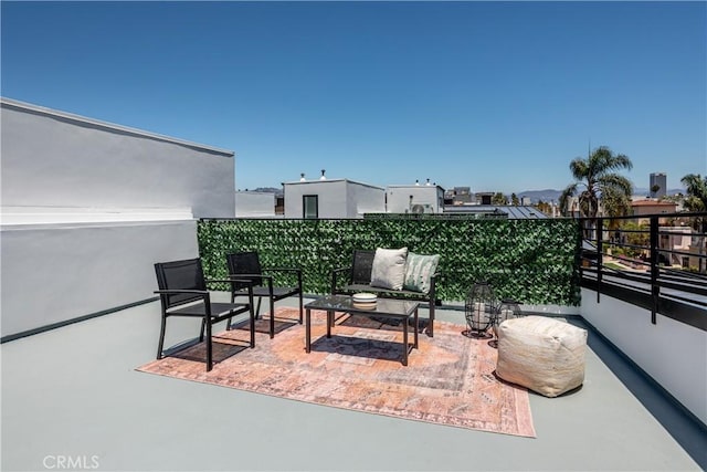 view of patio / terrace with a balcony