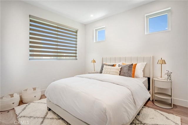 bedroom featuring recessed lighting, baseboards, and wood finished floors