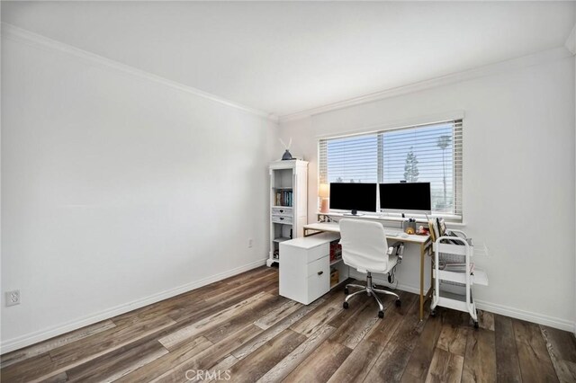 office area featuring dark wood-style floors, crown molding, and baseboards