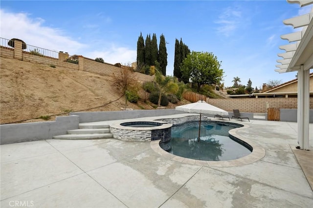 view of pool featuring a patio area, a fenced backyard, and a pool with connected hot tub