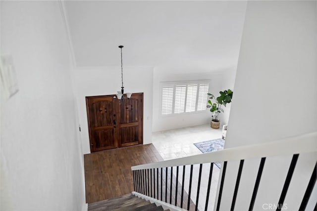 stairway featuring wood finished floors