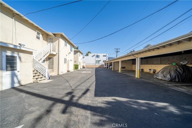 view of street with stairs and a residential view