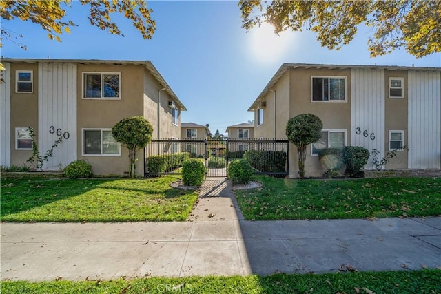 exterior space with a yard and fence