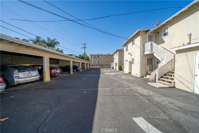 view of road featuring a residential view and stairway