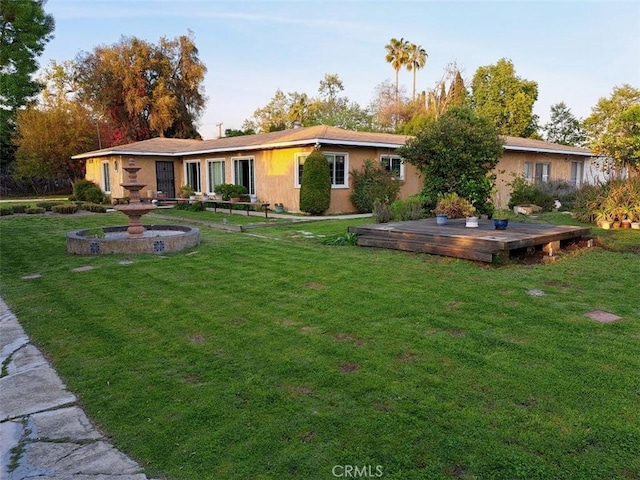 2609 E Cortez St, West Covina, CA 91791 - rear view of house featuring stucco siding, a yard, and a deck