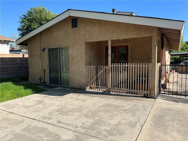 2609 E Cortez St, West Covina, CA 91791 - rear view of property featuring fence, a patio, and stucco siding