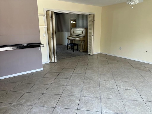 2609 E Cortez St, West Covina, CA 91791 - spare room featuring baseboards, a ceiling fan, and tile patterned flooring