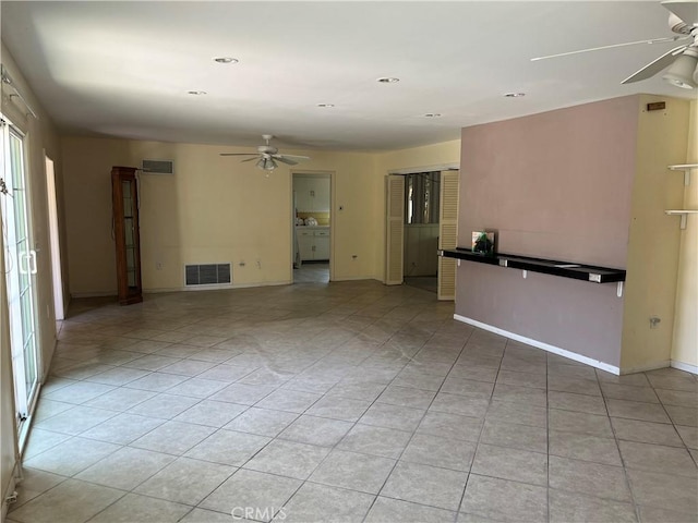 2609 E Cortez St, West Covina, CA 91791 - unfurnished living room featuring baseboards, visible vents, ceiling fan, and light tile patterned flooring