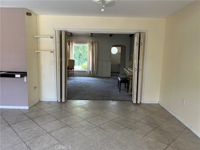 2609 E Cortez St, West Covina, CA 91791 - interior space featuring baseboards, a ceiling fan, light colored carpet, and light tile patterned floors
