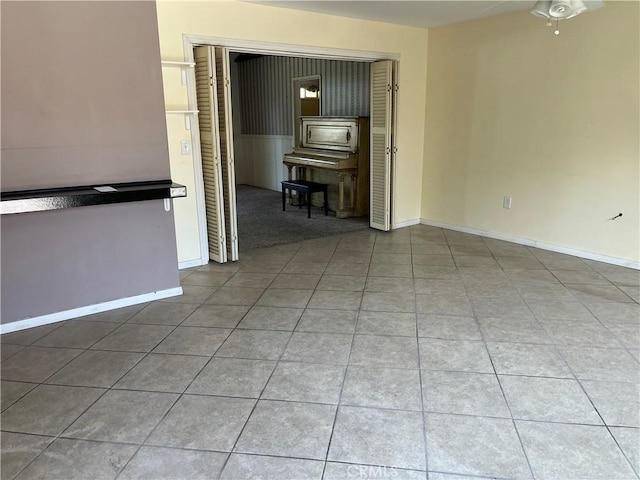 2609 E Cortez St, West Covina, CA 91791 - tiled empty room featuring a ceiling fan and baseboards