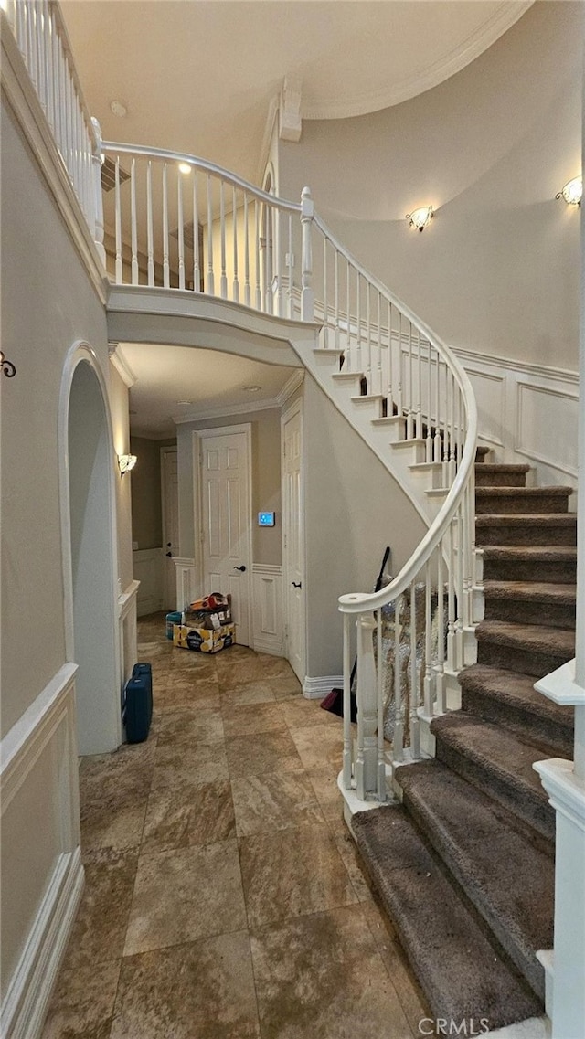 29123 Black Pine Way, Saugus, CA 91390 - foyer featuring a decorative wall, stairway, a high ceiling, ornamental molding, and a wainscoted wall