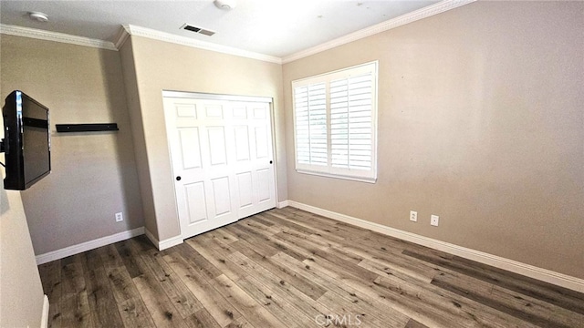 29123 Black Pine Way, Saugus, CA 91390 - unfurnished bedroom with ornamental molding, wood finished floors, and a closet