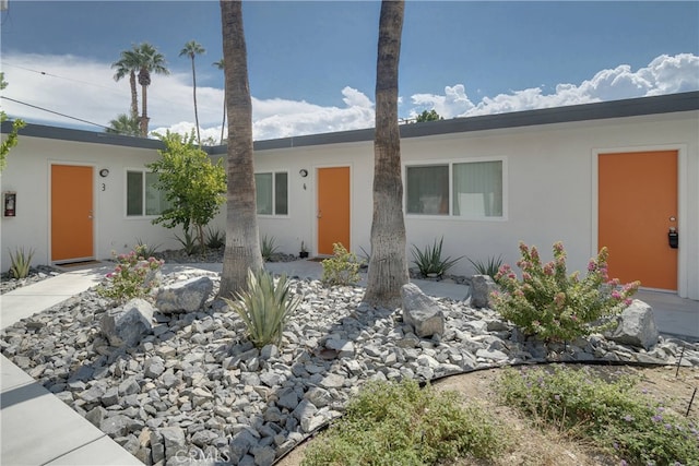 single story home with stucco siding