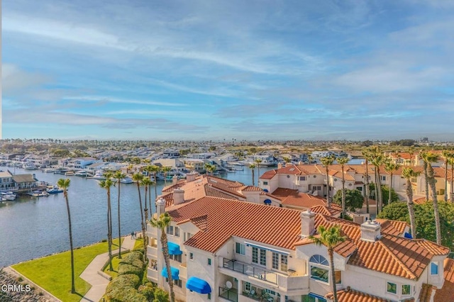 bird's eye view featuring a water view and a residential view