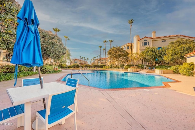 community pool with a patio