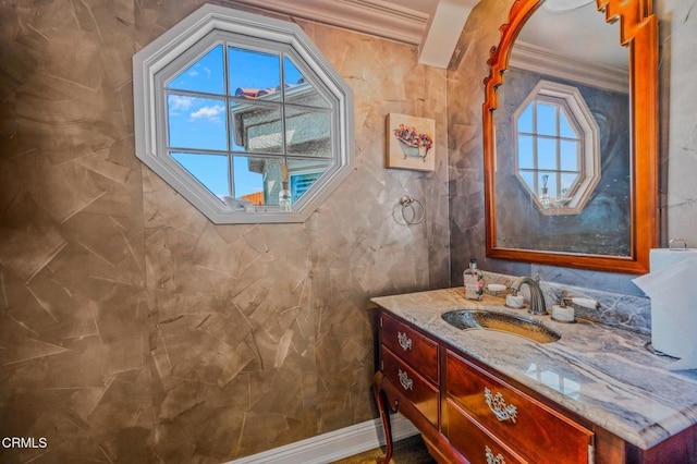 bathroom with vanity and ornamental molding