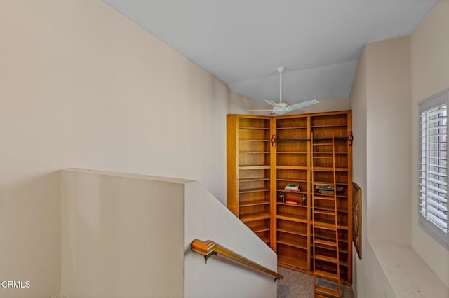 interior space with vaulted ceiling and ceiling fan