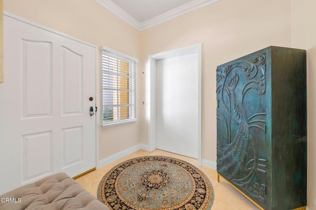 tiled foyer entrance featuring baseboards and ornamental molding