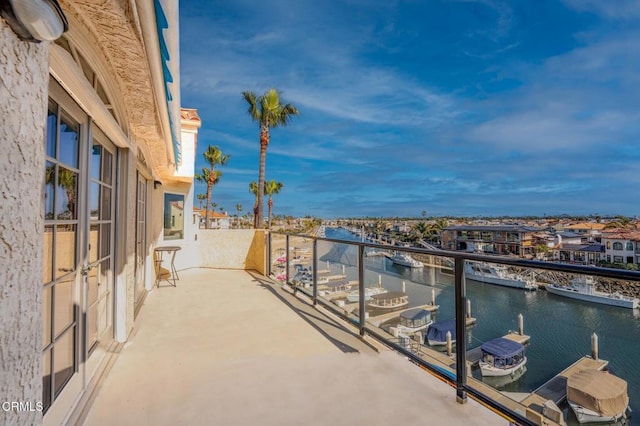 balcony featuring a water view