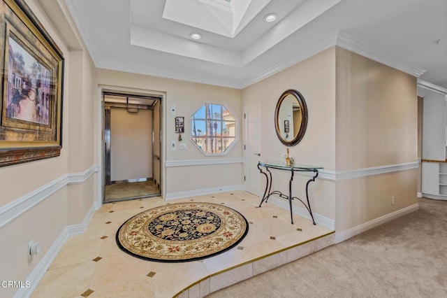 entrance foyer featuring a raised ceiling, a skylight, recessed lighting, and baseboards