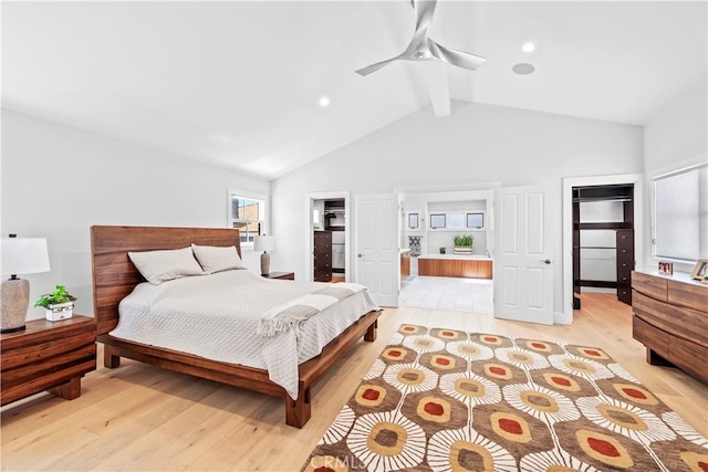 bedroom featuring ceiling fan, light wood-style flooring, a spacious closet, a closet, and beam ceiling