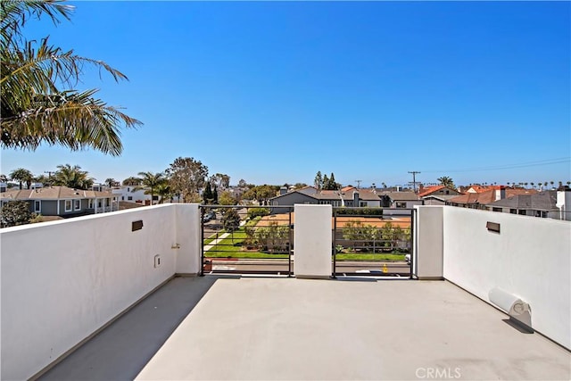 view of patio / terrace with a residential view and a balcony