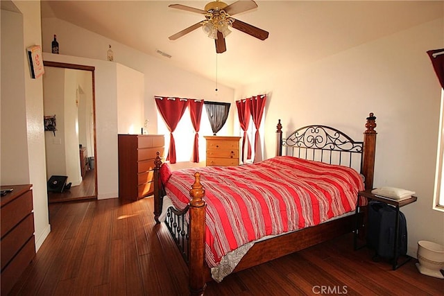 bedroom with lofted ceiling, ceiling fan, wood-type flooring, and visible vents