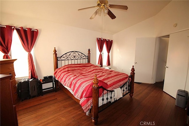 bedroom with a ceiling fan, lofted ceiling, and wood-type flooring