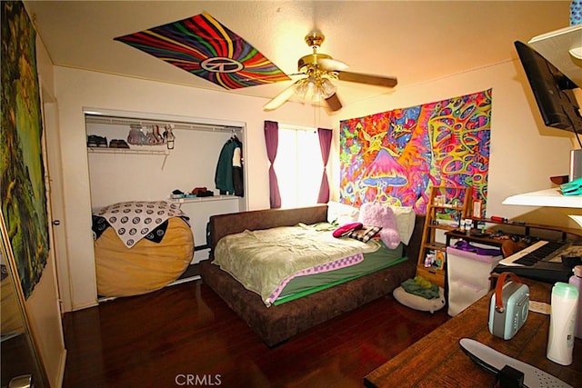 bedroom with wood finished floors and a ceiling fan