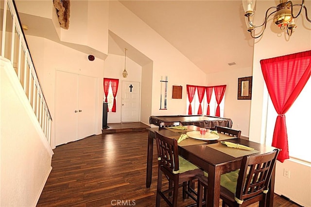 dining room featuring lofted ceiling, stairway, and wood finished floors